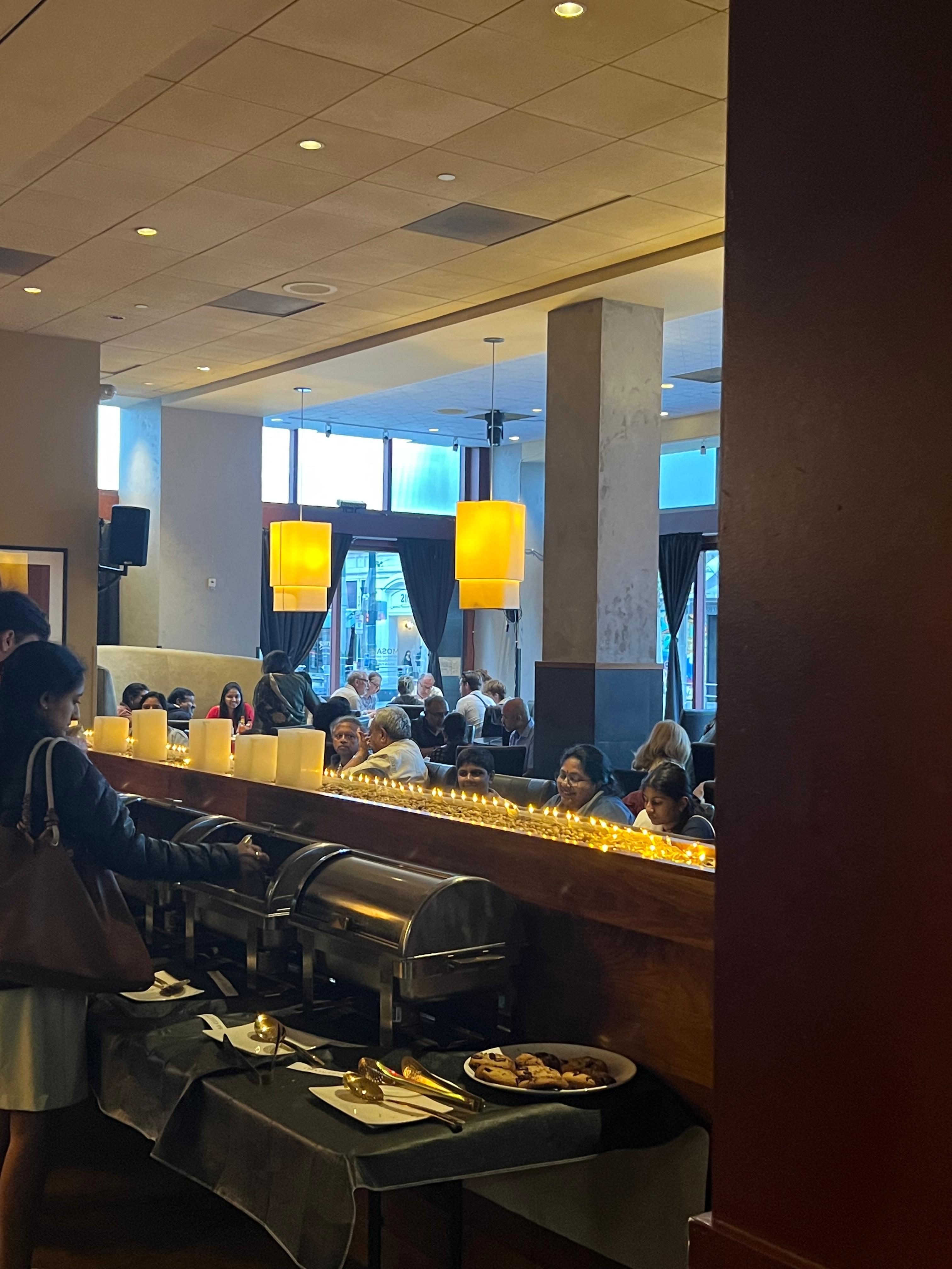 Catering buffet spread with chafing dishes and candlelight